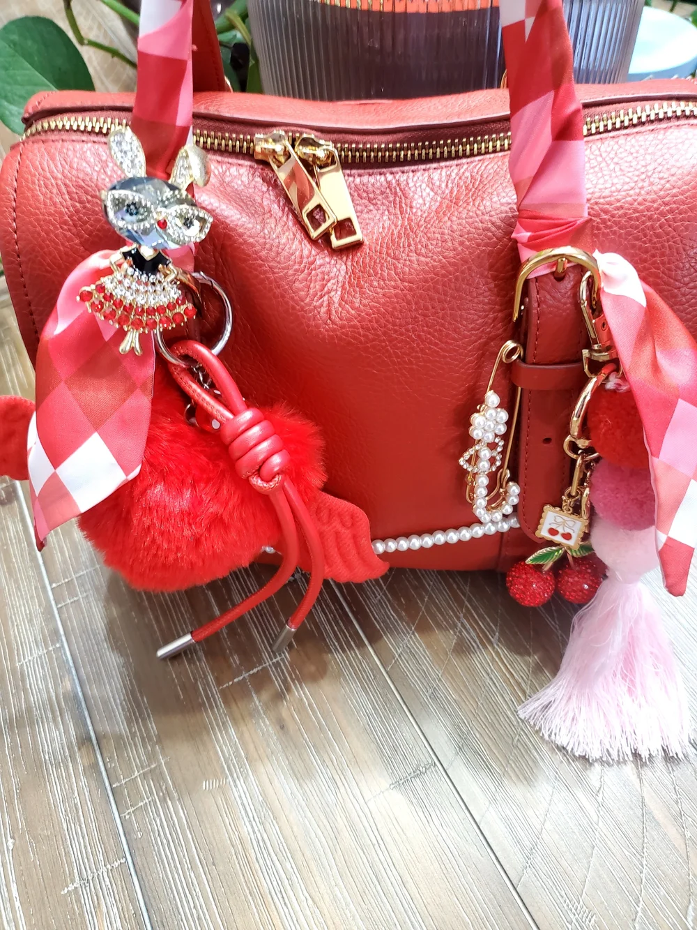 Red Leather Satchel Handbag with Decorative Charms